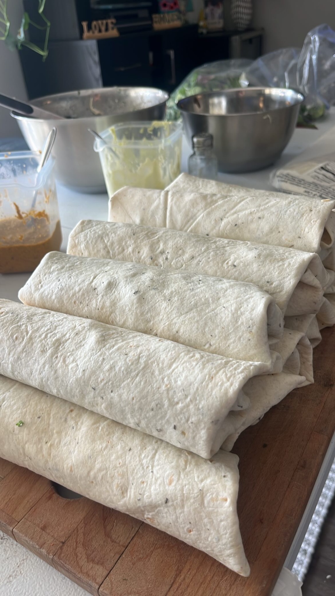 A large batch of freshly prepared wraps ready for a business event