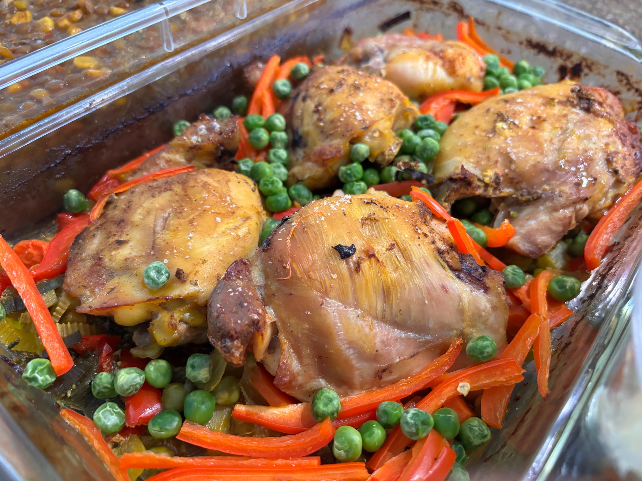 Roasted chicken and vegetables presented for catered service